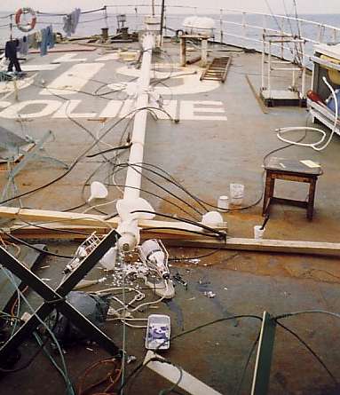 Failed fibreglass mast on deck in pieces