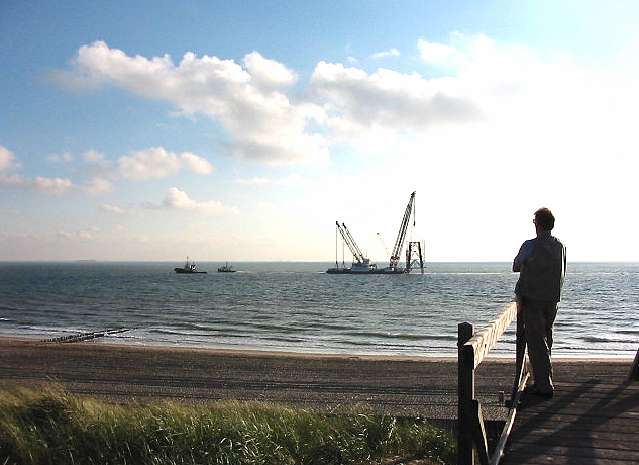 A pair of Tugs & Crane Barge