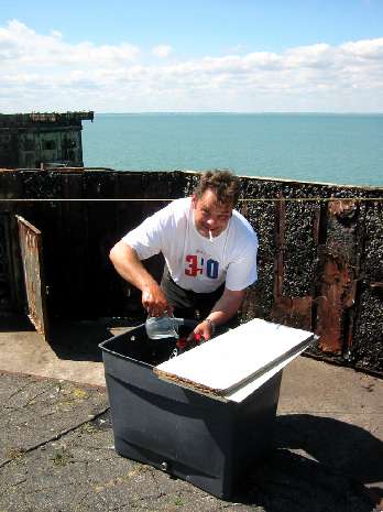 Big Phil fills solar shower tank Big Phil fills solar shower tank